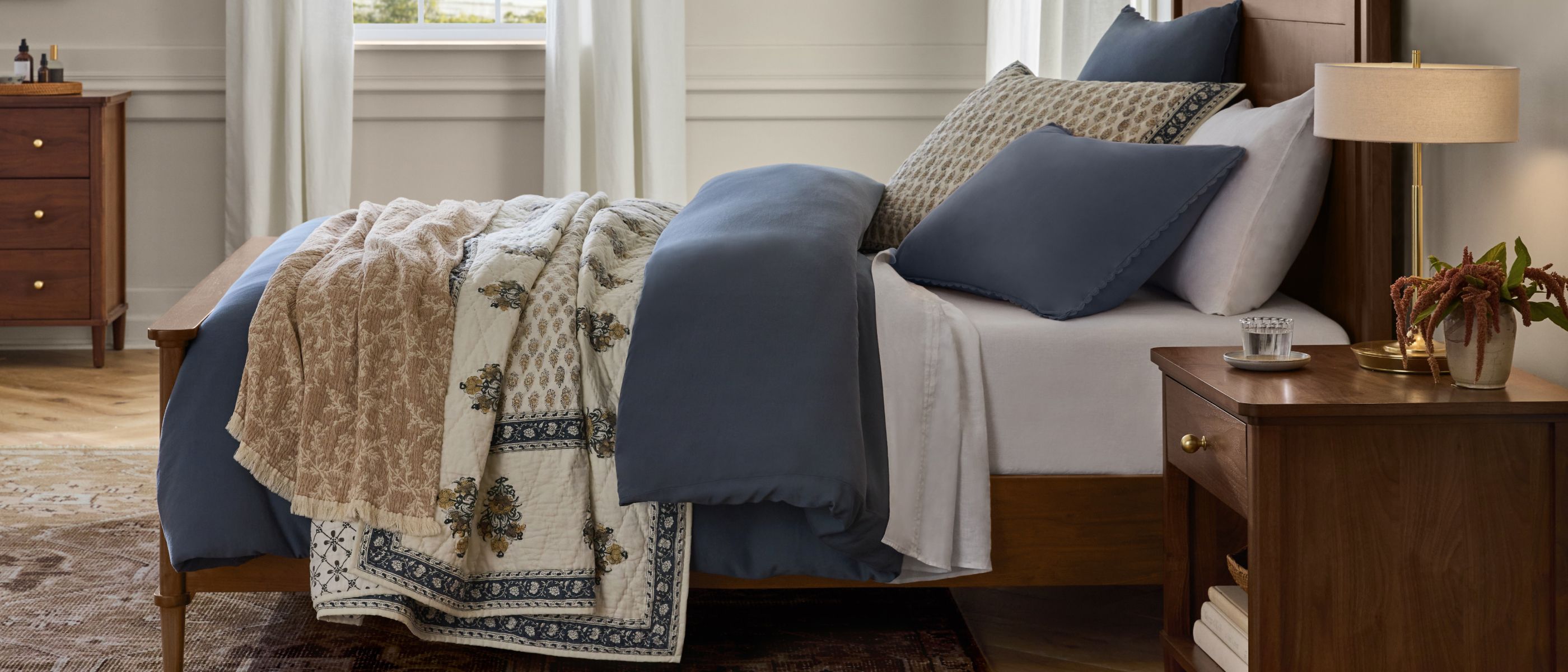 The solid Matte Sateen Cotton Duvet is a soothing foundation for the Bryleigh Quilt’s block-print botanical design, handstitched by Nest Certified artisans.