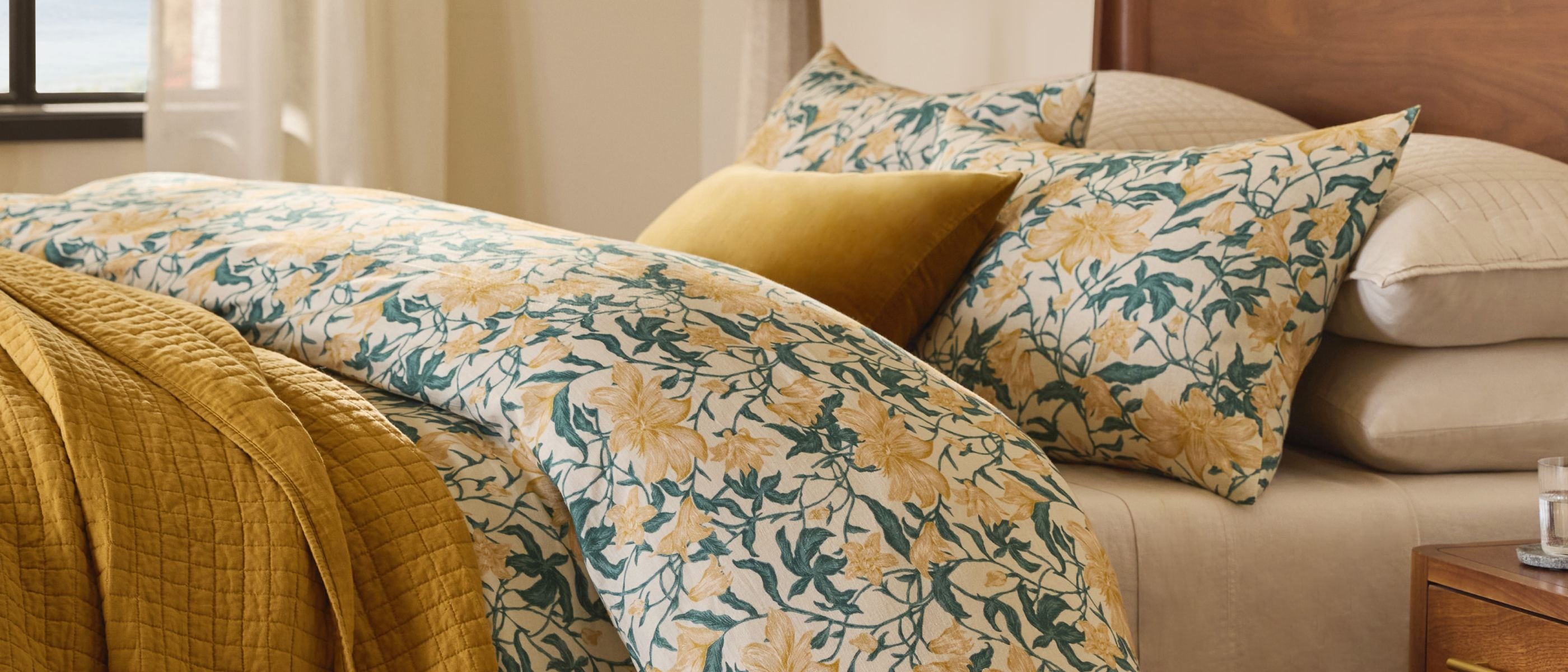 Drench your space in shades of yellow—the marigold Belgian Linen Quilt and Italian Velvet Pillow bring out the lively hues of the Garden Botanical Duvet.